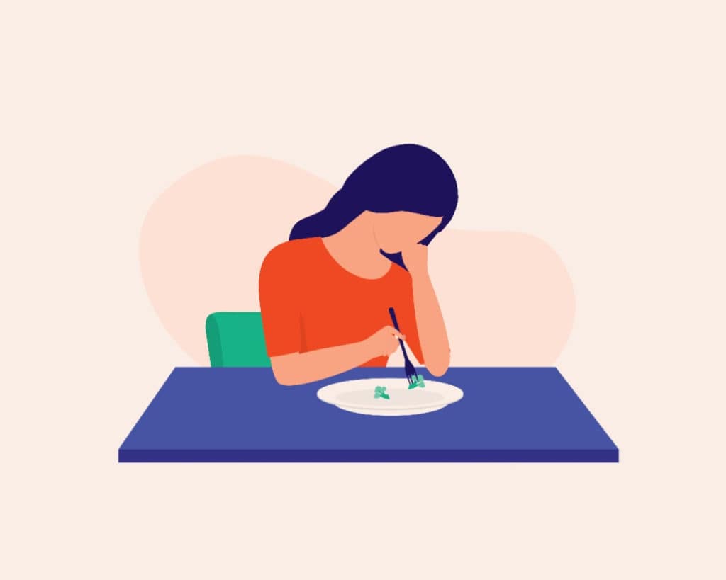 Illustration of woman sitting at table picking at her plate.